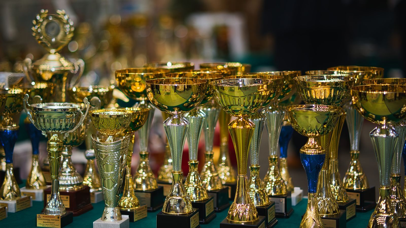 Rows of gold trophies lined up for presentation, like the many cruise industry awards given each year