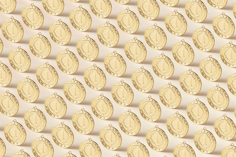 Rows of identical gold medals